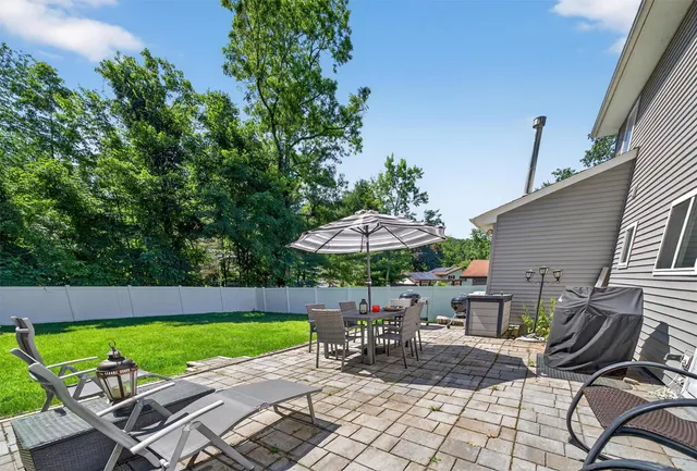 an outdoor space with furniture and umbrella