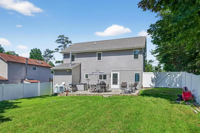 a front view of house with yard and seating area