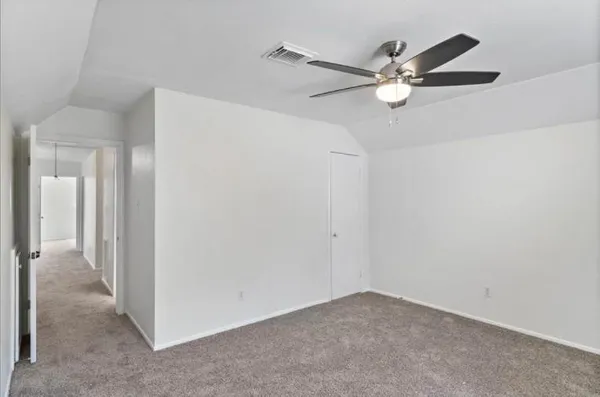 a view of a livingroom with a ceiling fan