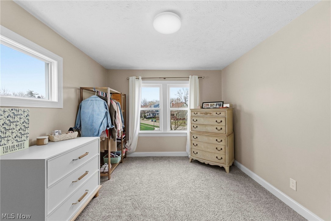 3525 Silsby Road Cleveland, OH 44118 - Photo 20 of 44 Bedroom with light colored carpet and a textured ceiling