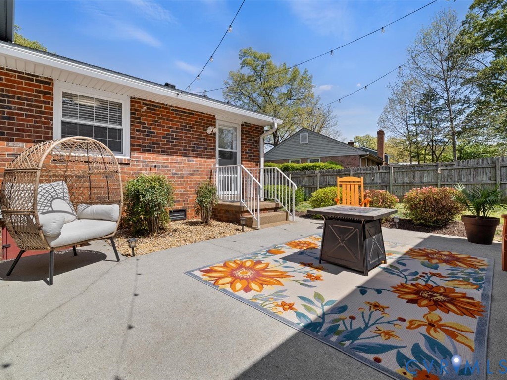 1455 Robindale Road Richmond, VA 23235 - Photo 11 of 29 a backyard of a house with barbeque oven table and chairs