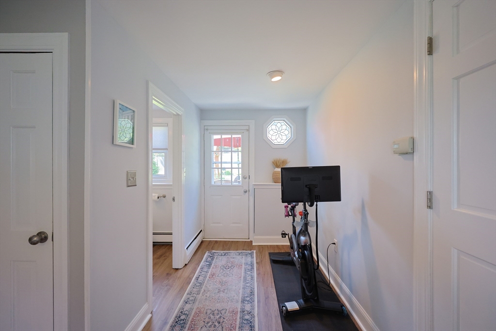 61 Colwell Drive Dedham, MA 02026 - Photo 22 of 32 a view of a hallway with a livingroom