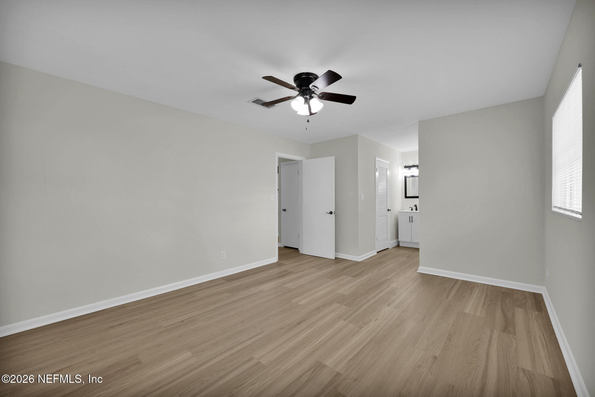 8544 Sanchez Road Jacksonville, FL 32217 - Photo 35 of 46 wooden floor in an empty room with a window