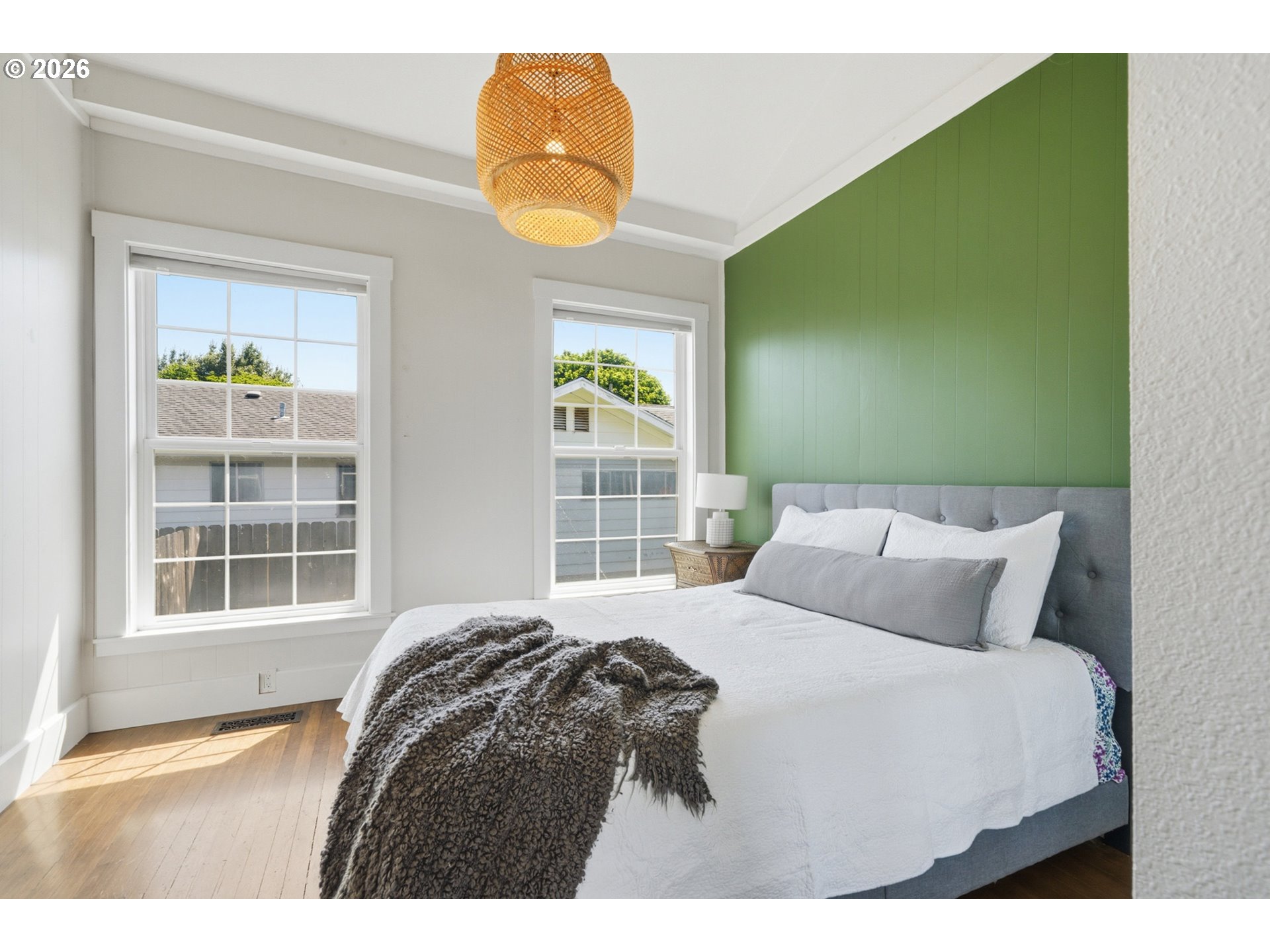 1802 8th Street Tillamook, OR 97141 - Photo 17 of 37 a bedroom with a bed and a window