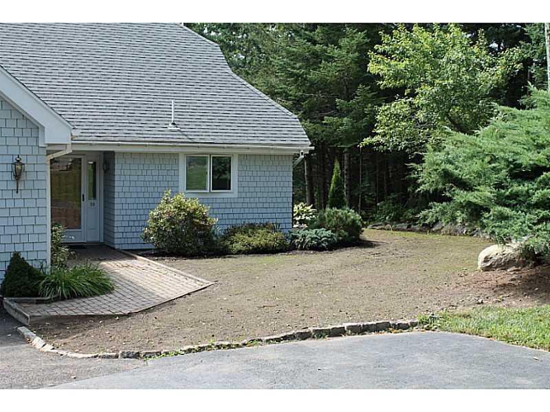 19 West Harbor Pond Road, Unit 19B West Boothbay Harbor, ME 04575 - Photo 13 of 13 Exterior Back. Showing 1-car garage...