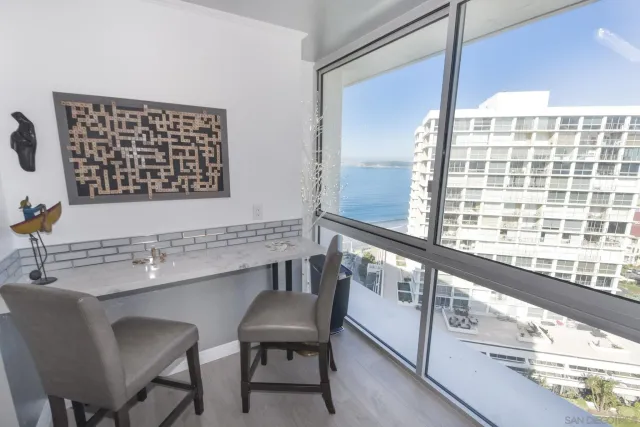 a kitchen with a window a sink and a refrigerator