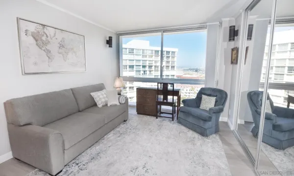 a living room with furniture and a large window