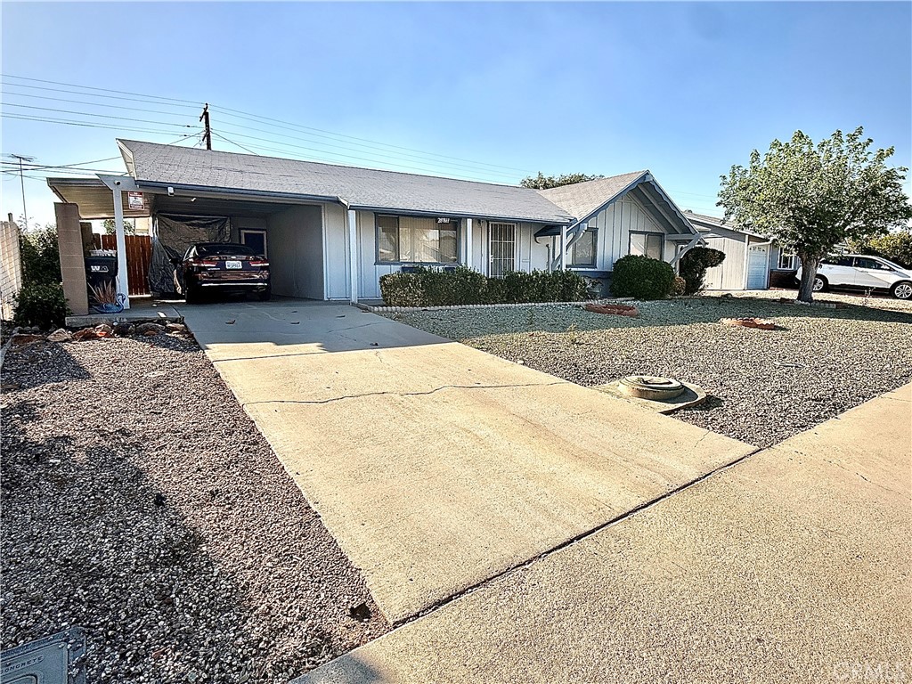 28811 Carmel Road Menifee, CA 92586 - Photo 2 of 14 a front view of a house with a yard