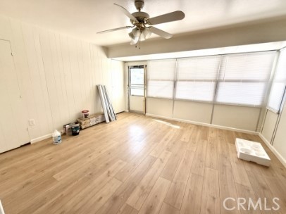 28811 Carmel Road Menifee, CA 92586 - Photo 5 of 14 a view of a room with wooden floor and windows