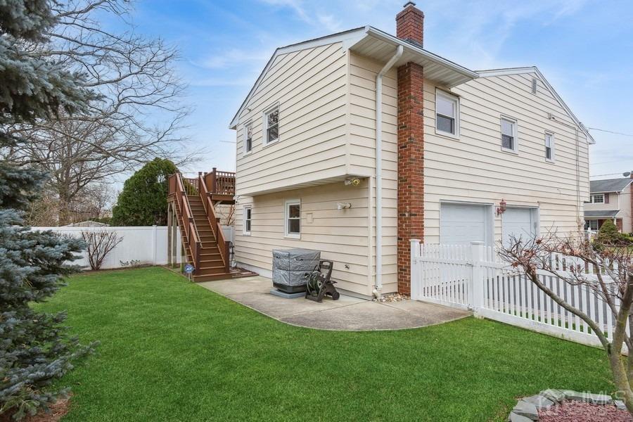 34 South Cliff Road Colonia, NJ 07067 - Photo 20 of 29 a view of a house with a yard and deck
