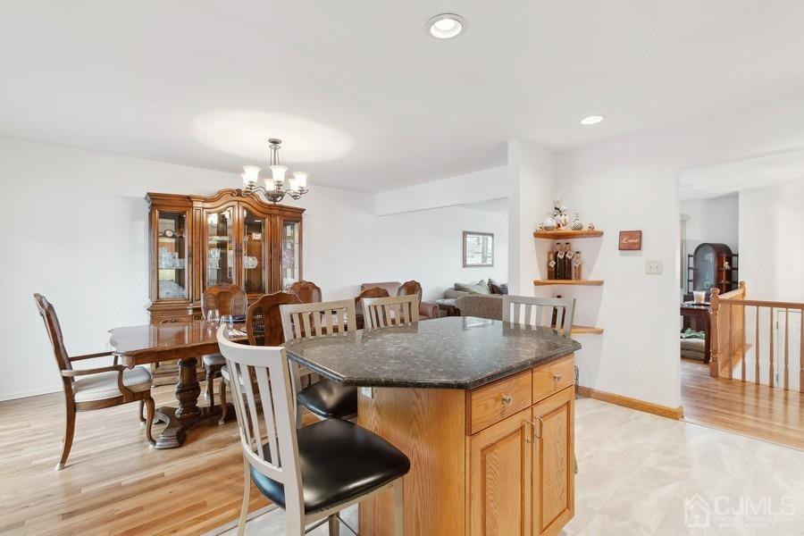 34 South Cliff Road Colonia, NJ 07067 - Photo 5 of 29 a view of a dining room with furniture and wooden floor