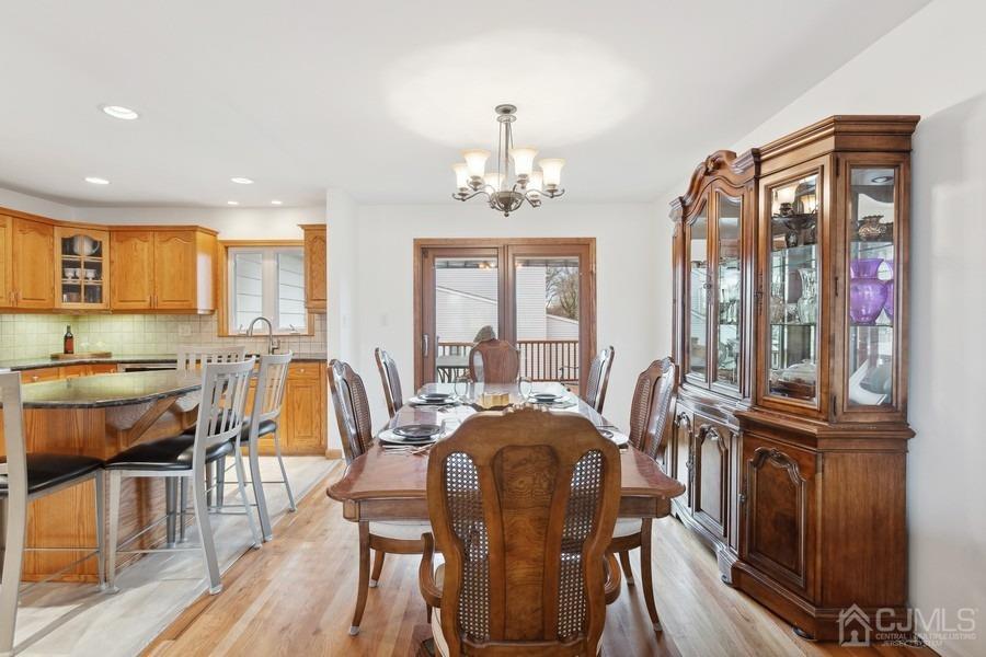 34 South Cliff Road Colonia, NJ 07067 - Photo 6 of 29 a view of a a dining room with furniture window and wooden floor