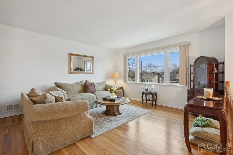 34 South Cliff Road Colonia, NJ 07067 - Photo 7 of 29 a living room with furniture and a large window