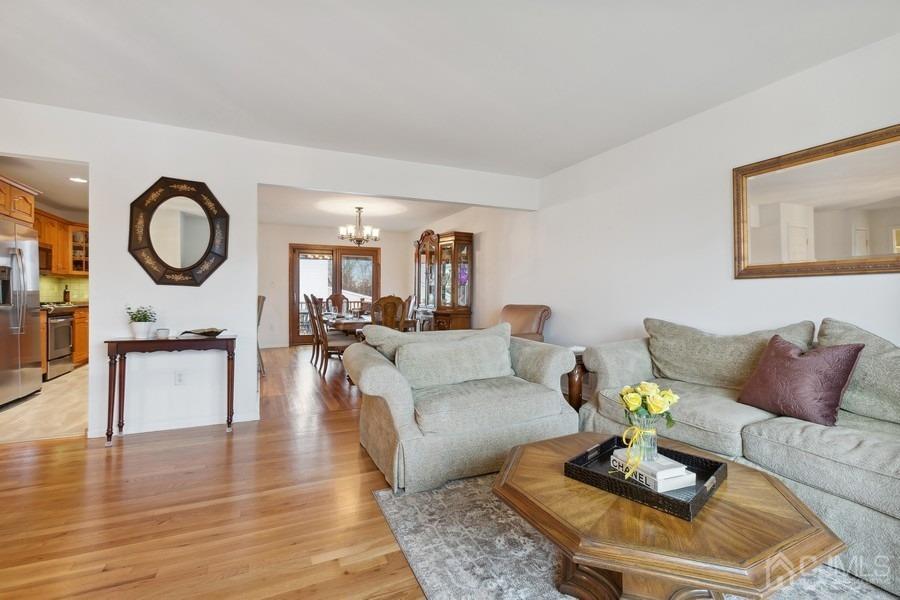 34 South Cliff Road Colonia, NJ 07067 - Photo 8 of 29 a living room with furniture a rug and a fireplace