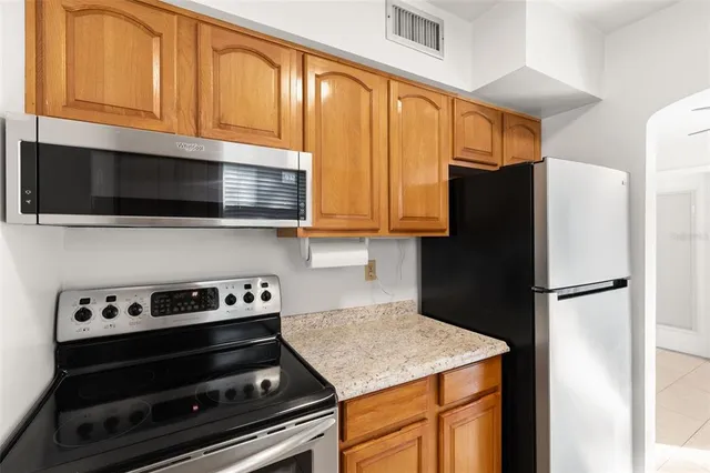 a kitchen with a sink and a window