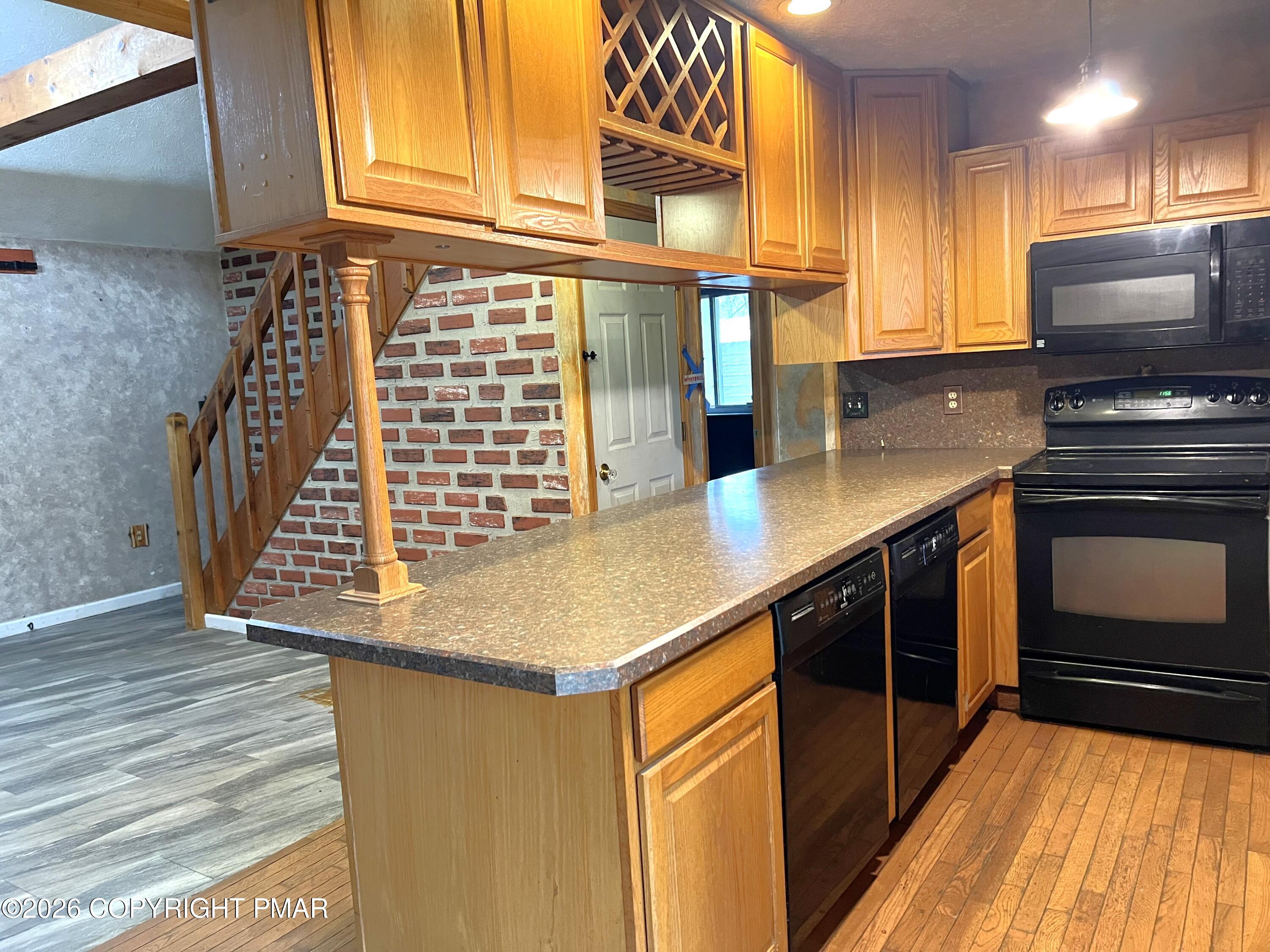 152 Fairview Avenue Mount Pocono, PA 18344 - Photo 13 of 27 a kitchen with kitchen island granite countertop a stove and a sink