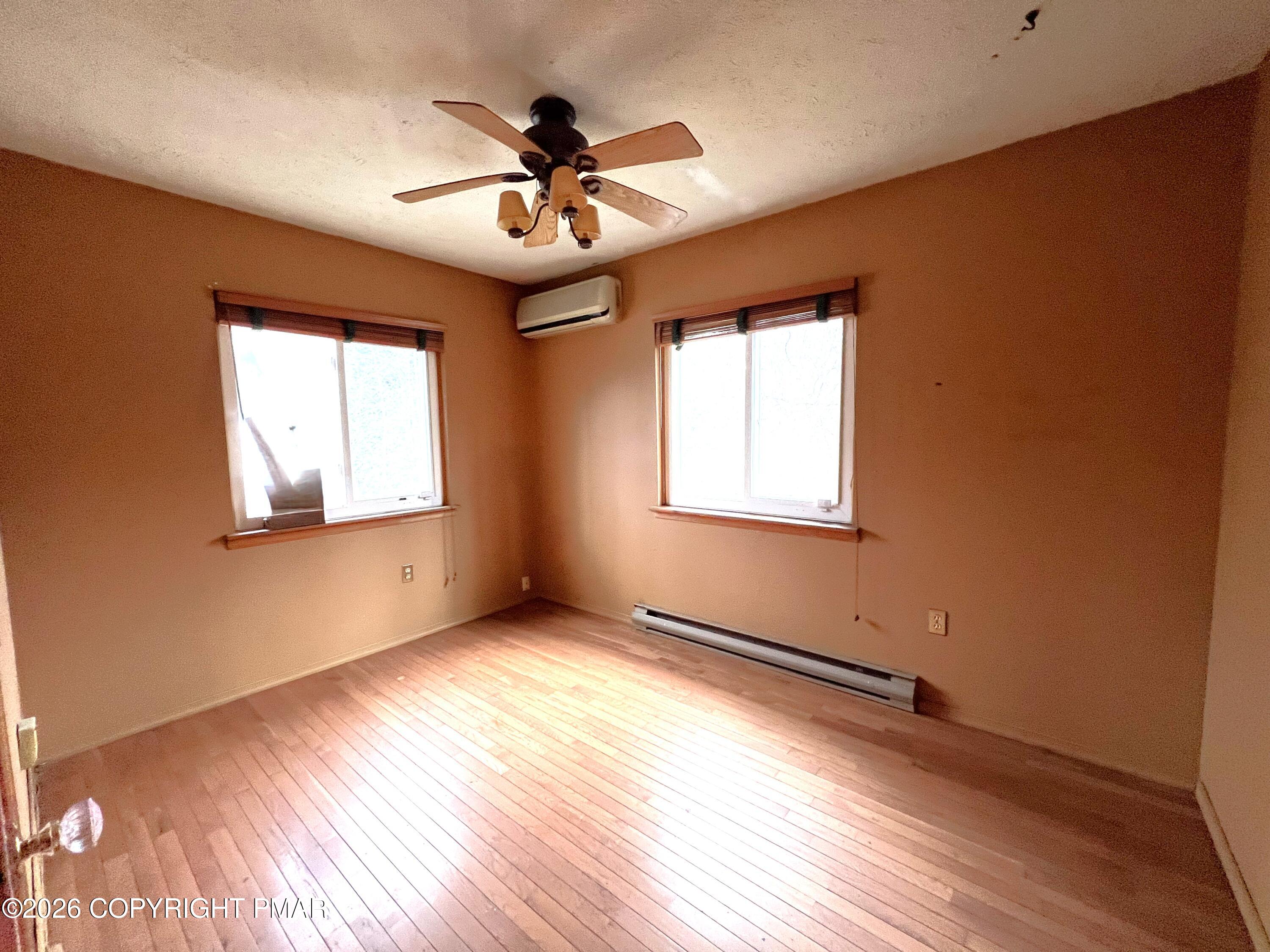 152 Fairview Avenue Mount Pocono, PA 18344 - Photo 20 of 27 a view of empty room with wooden floor and fan