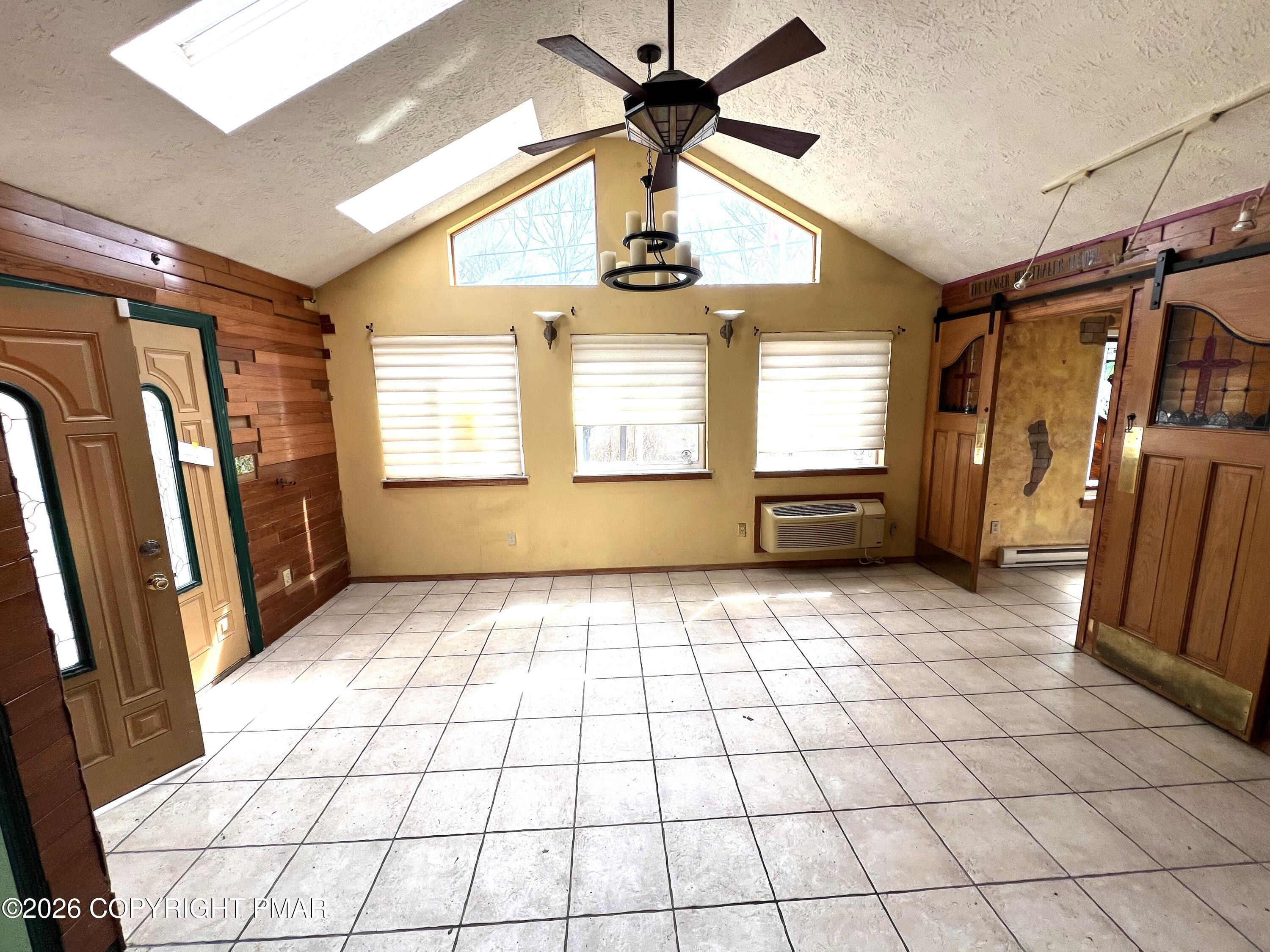 152 Fairview Avenue Mount Pocono, PA 18344 - Photo 2 of 27 a view of empty room with wooden floor and fan
