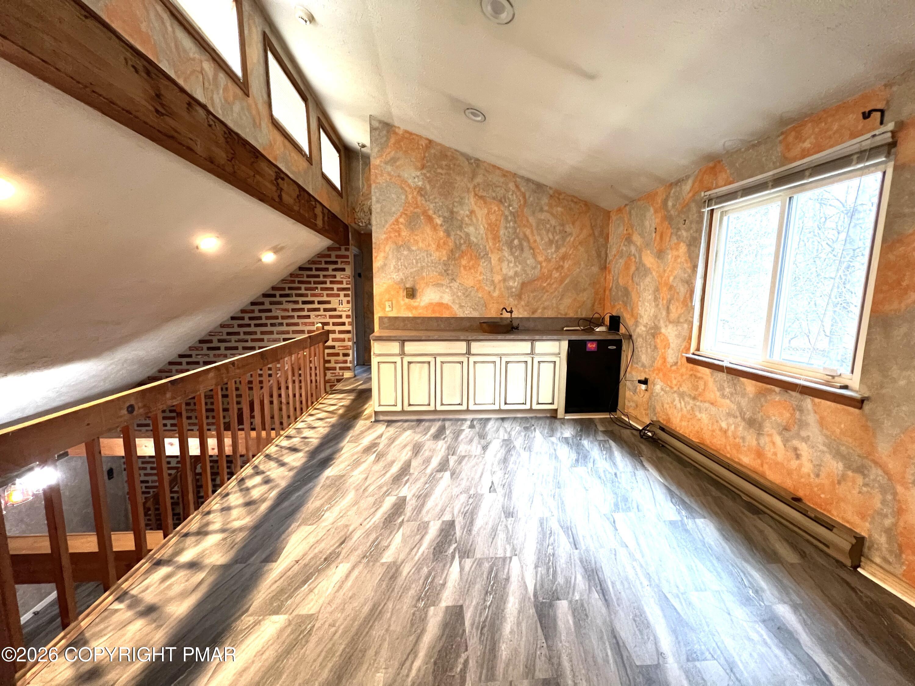 152 Fairview Avenue Mount Pocono, PA 18344 - Photo 24 of 27 a view of a room with wooden floor and stairs