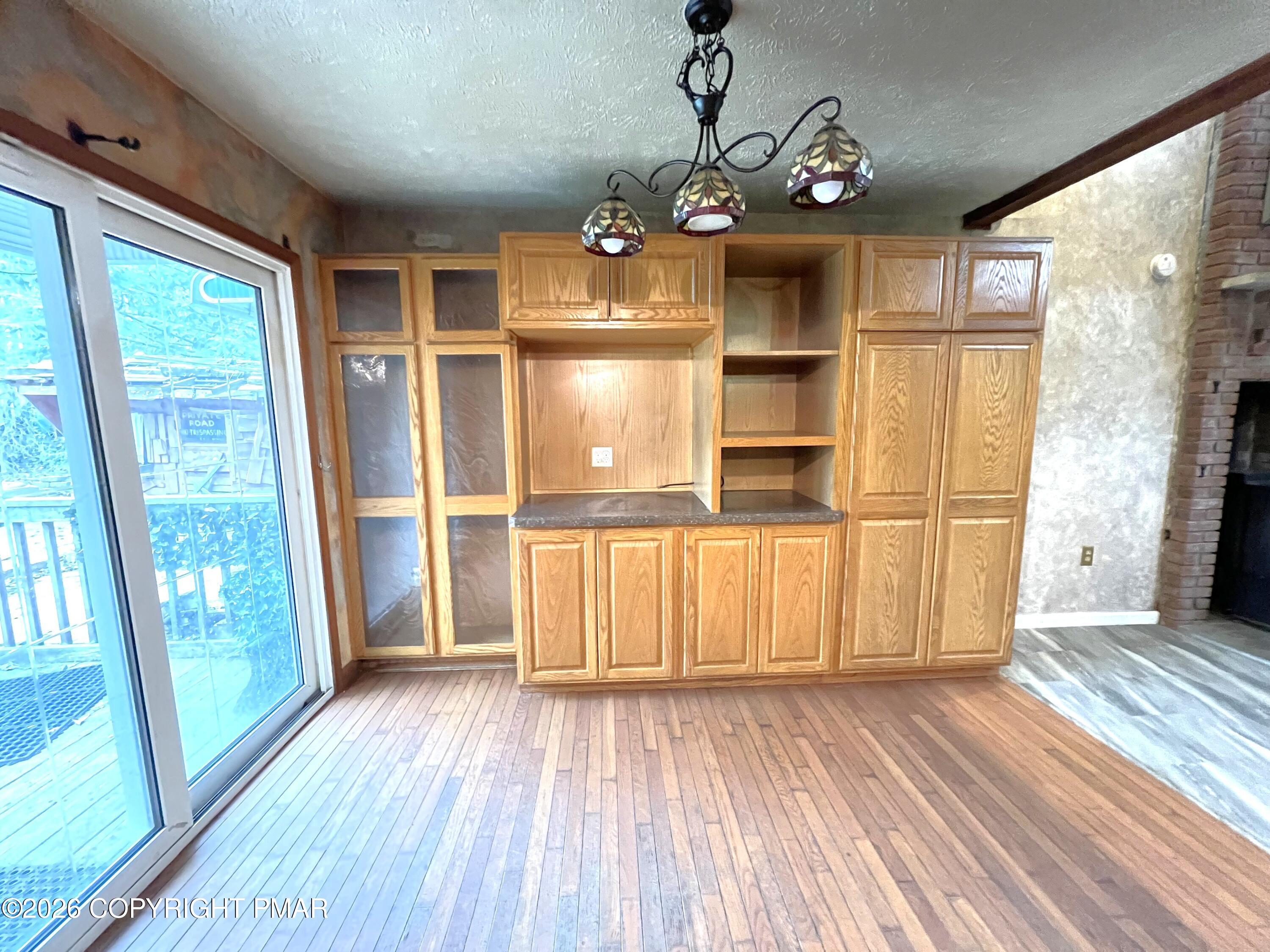 152 Fairview Avenue Mount Pocono, PA 18344 - Photo 8 of 27 a view of a kitchen with wooden floor and a refrigerator