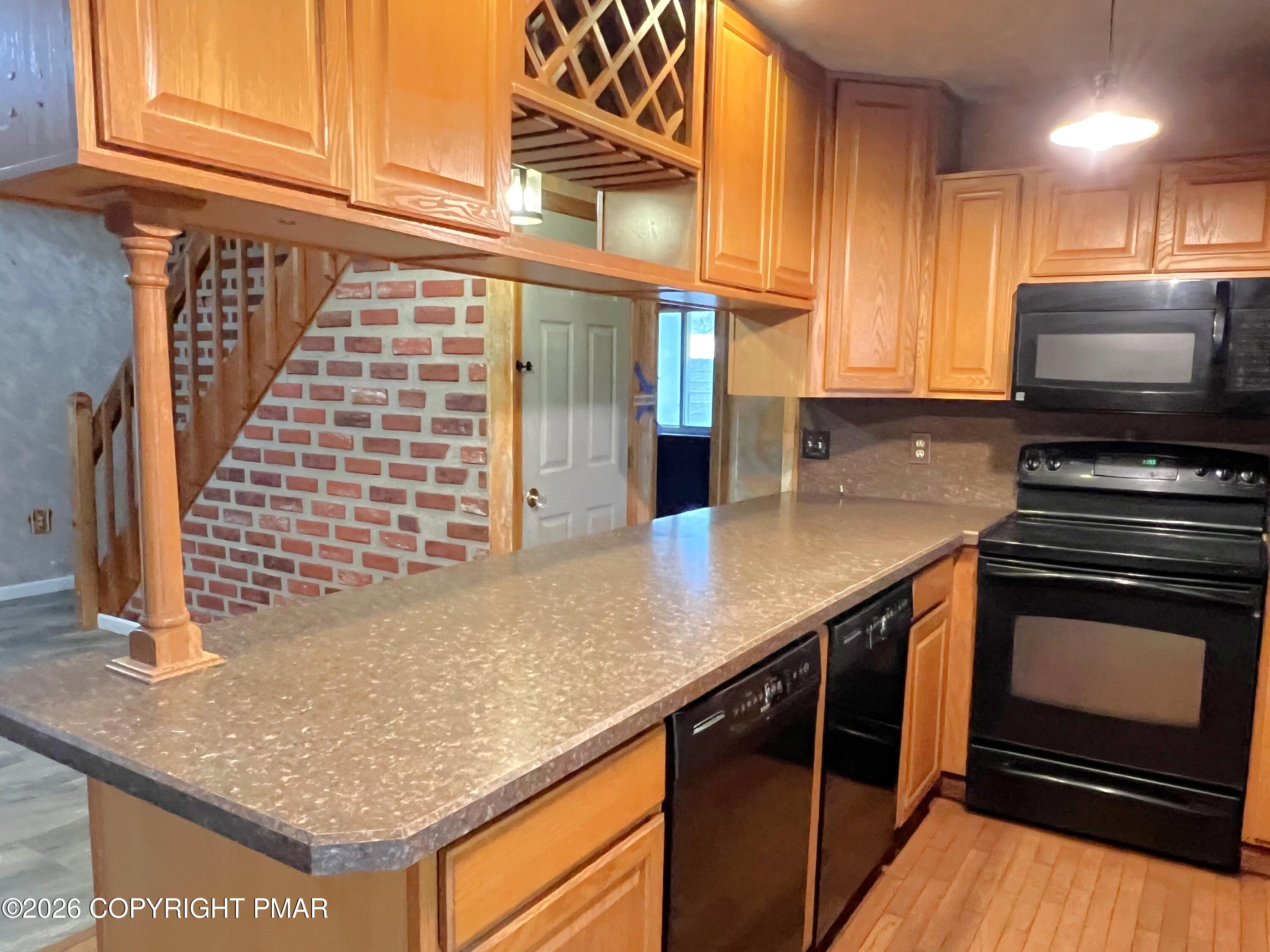 152 Fairview Avenue Mount Pocono, PA 18344 - Photo 10 of 27 a kitchen with stainless steel appliances granite countertop a sink and a stove
