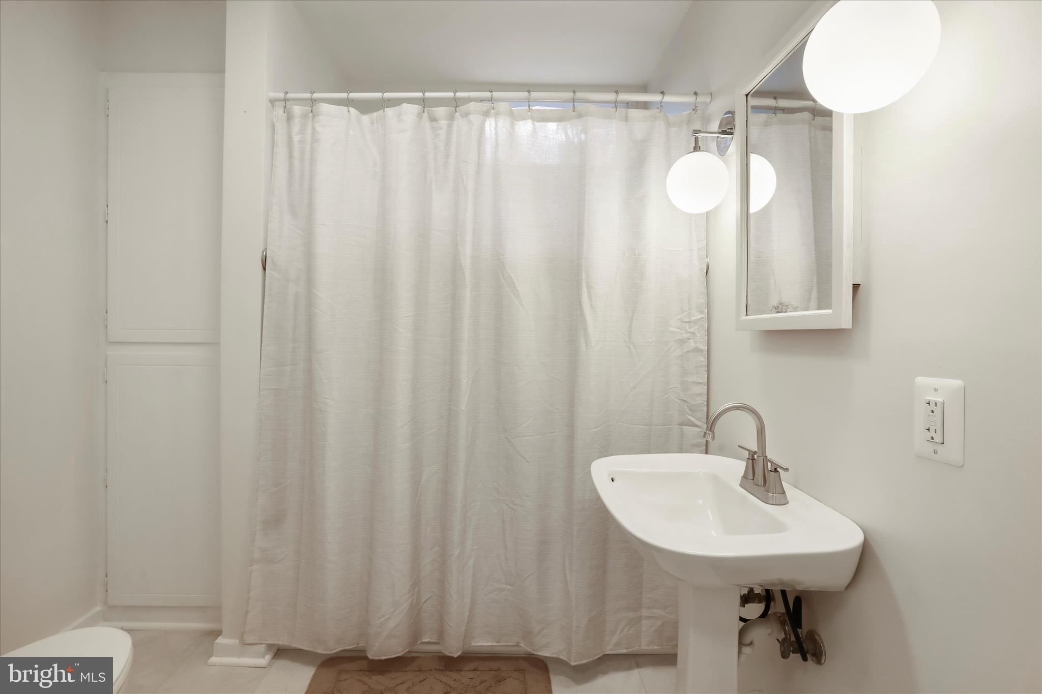 84 Funk Road Strasburg, VA 22657 - Photo 13 of 45 a bathroom with a sink and a mirror