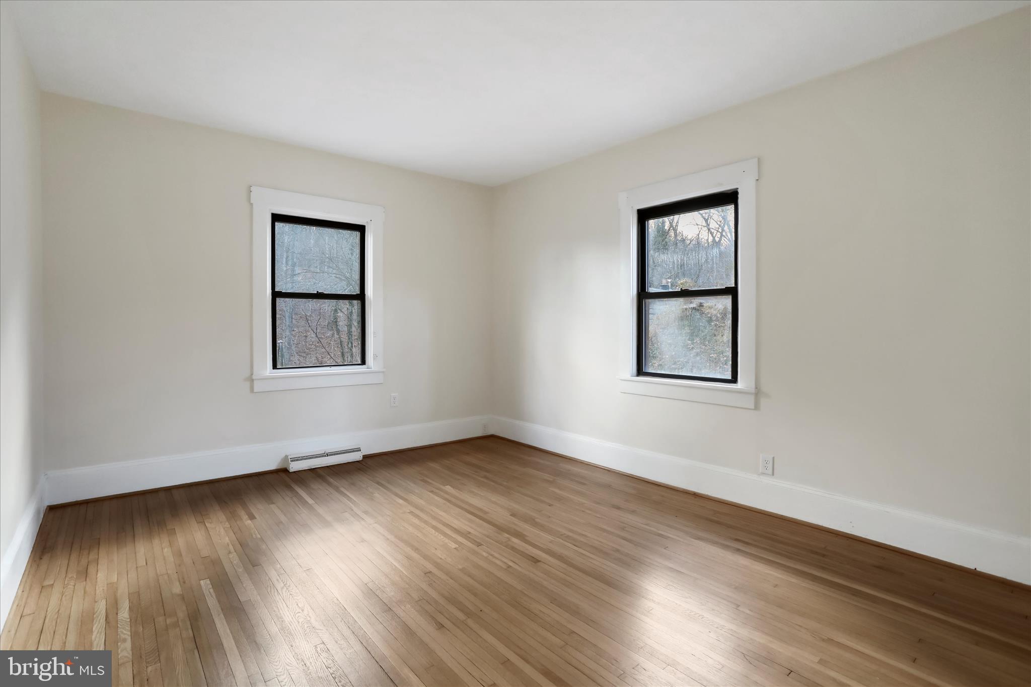 84 Funk Road Strasburg, VA 22657 - Photo 14 of 45 a view of an empty room with wooden floor and a window