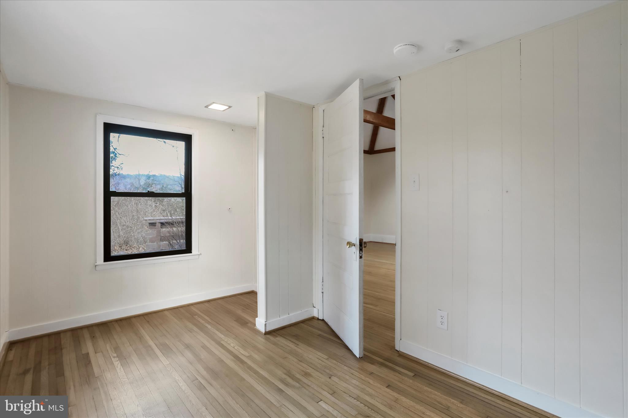 84 Funk Road Strasburg, VA 22657 - Photo 17 of 45 a view of an empty room with wooden floor and closet