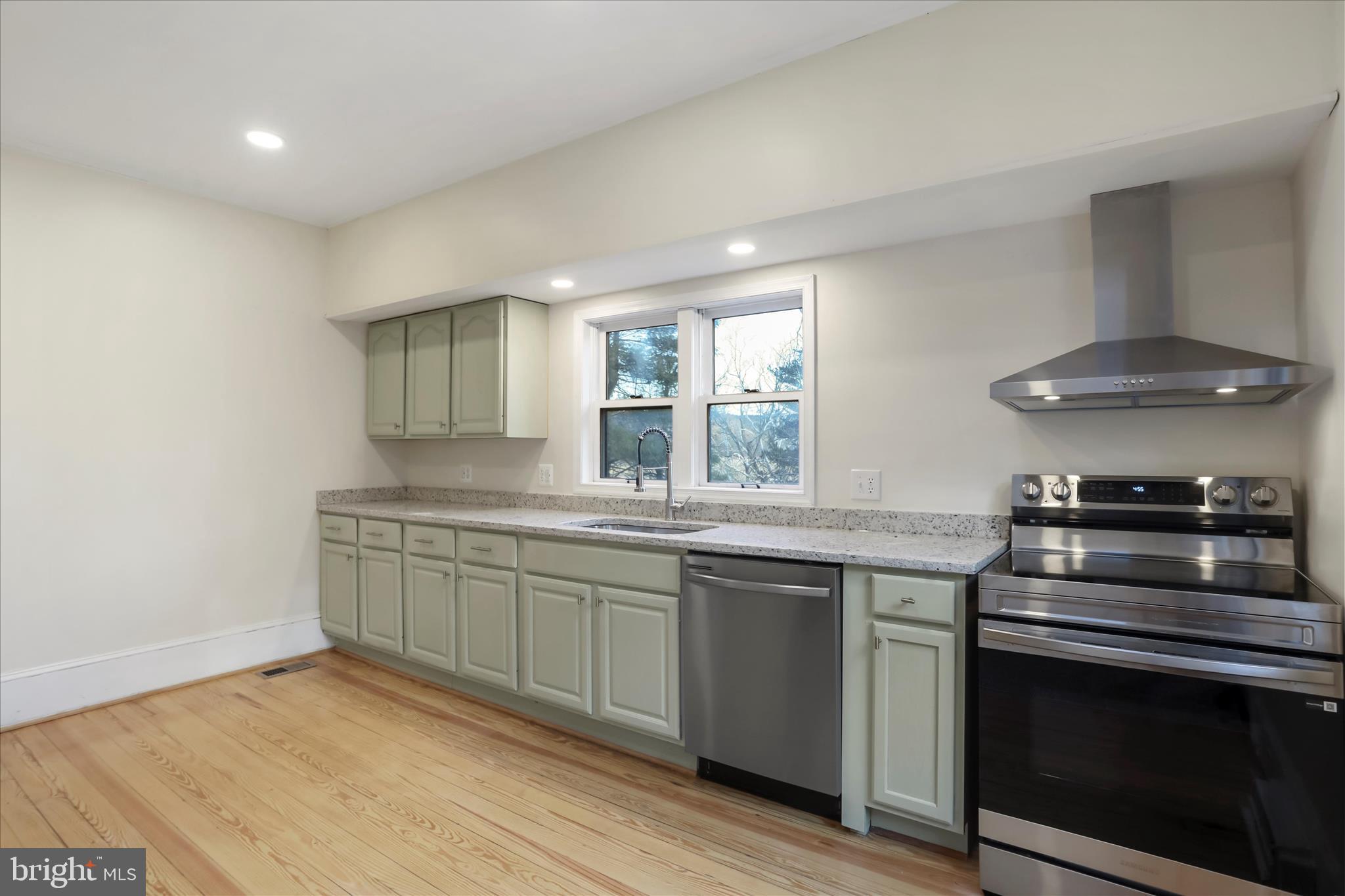 84 Funk Road Strasburg, VA 22657 - Photo 4 of 45 a kitchen with stainless steel appliances granite countertop a stove and a sink