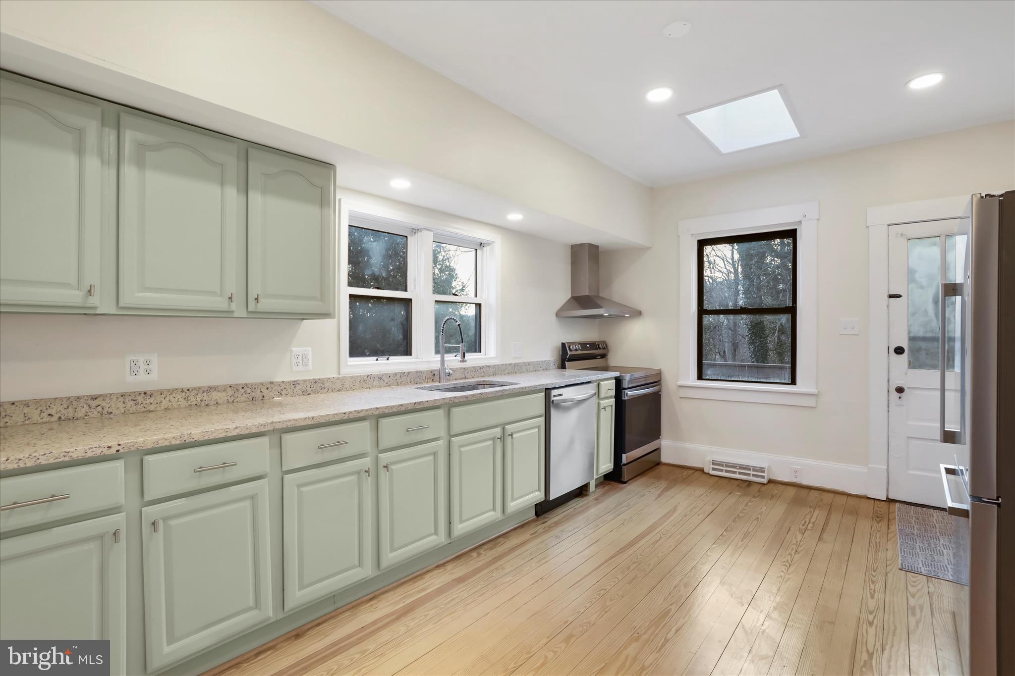 84 Funk Road Strasburg, VA 22657 - Photo 5 of 45 a kitchen with sink cabinets and wooden floor