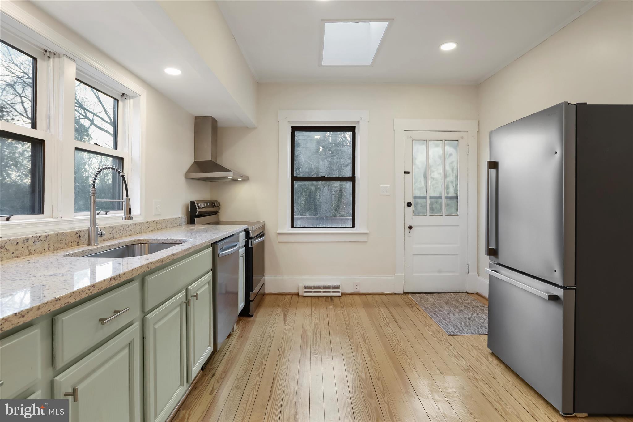 84 Funk Road Strasburg, VA 22657 - Photo 6 of 45 a kitchen with a refrigerator and a sink