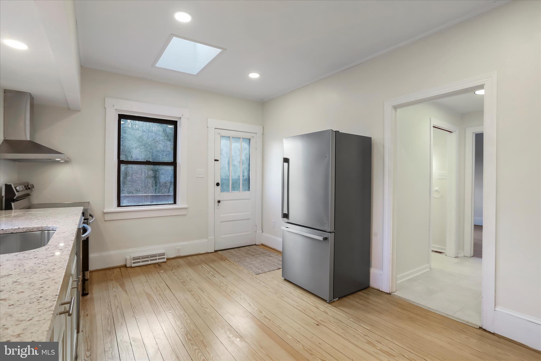 84 Funk Road Strasburg, VA 22657 - Photo 7 of 45 a kitchen with stainless steel appliances granite countertop a refrigerator and a stove top oven
