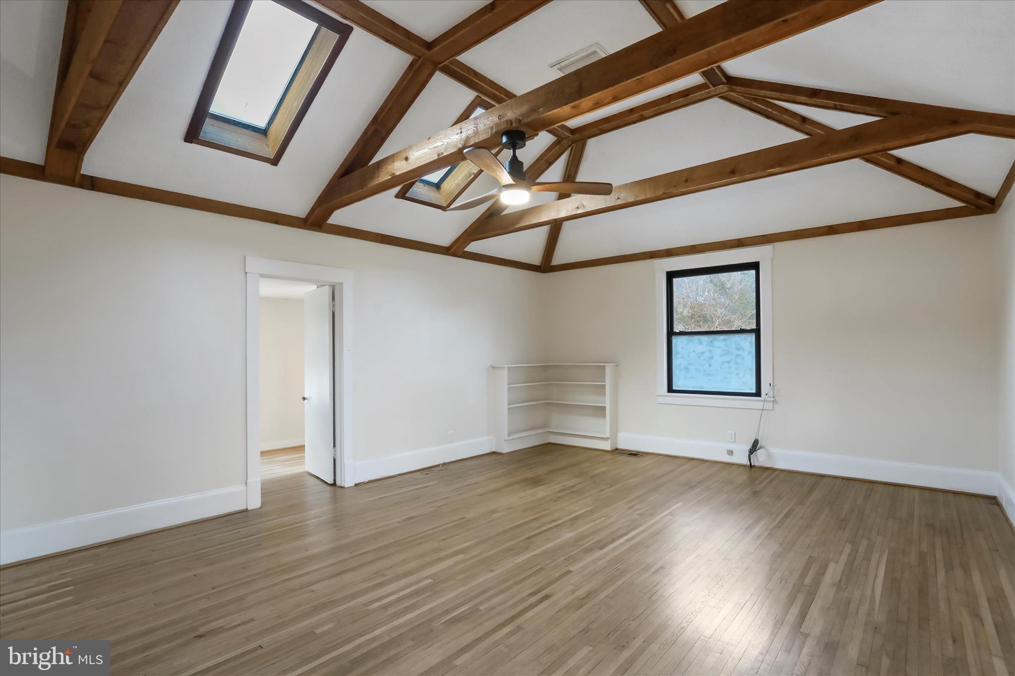 84 Funk Road Strasburg, VA 22657 - Photo 8 of 45 a view of an empty room with wooden floor and a window