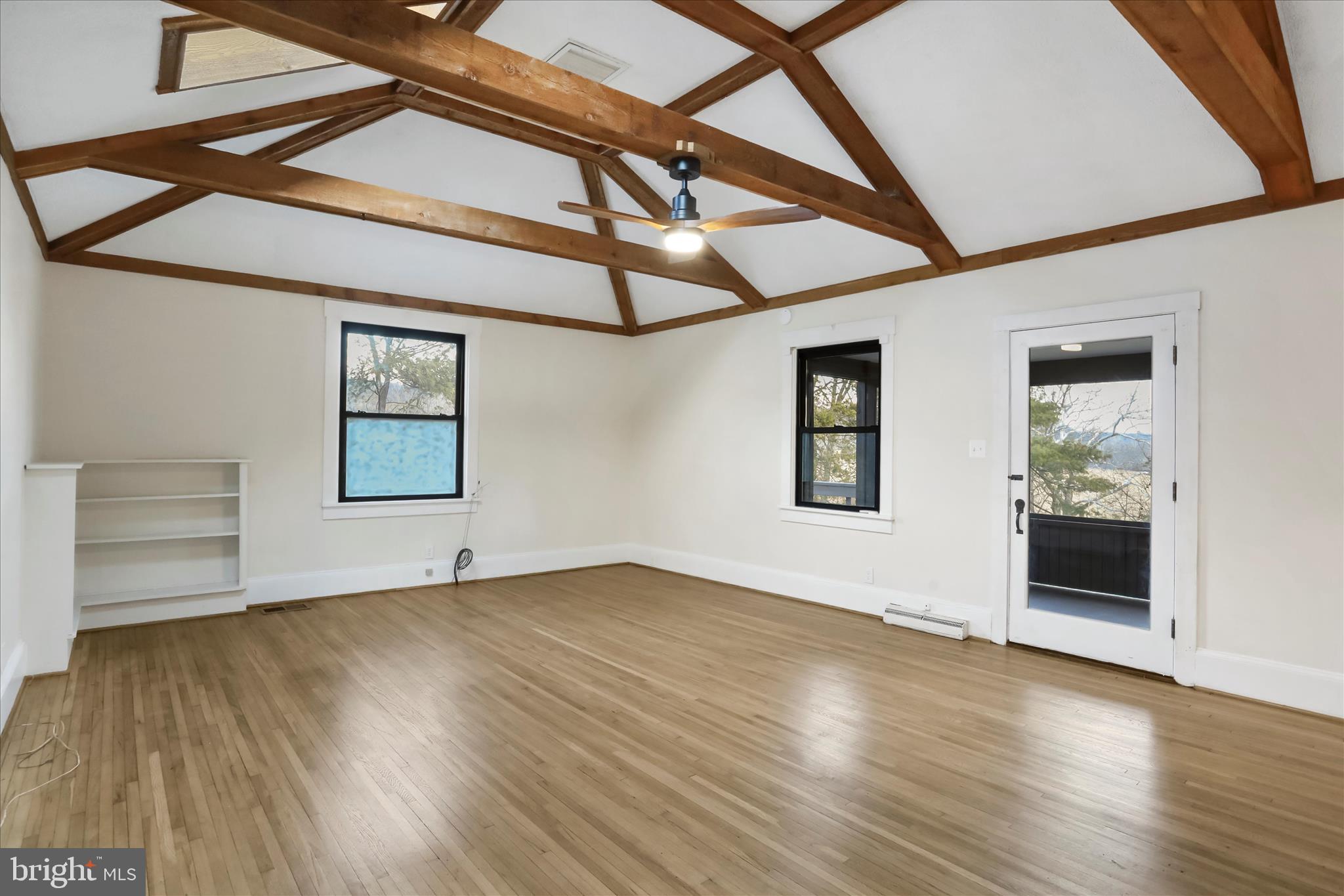84 Funk Road Strasburg, VA 22657 - Photo 9 of 45 a view of an empty room with a window and wooden floor