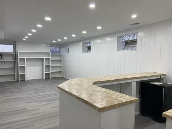 a kitchen with a sink and a refrigerator