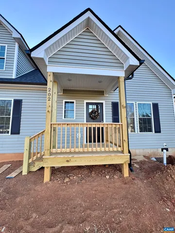a kitchen with granite countertop a sink and a stove