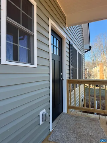 a kitchen with stainless steel appliances granite countertop a stove and white cabinets