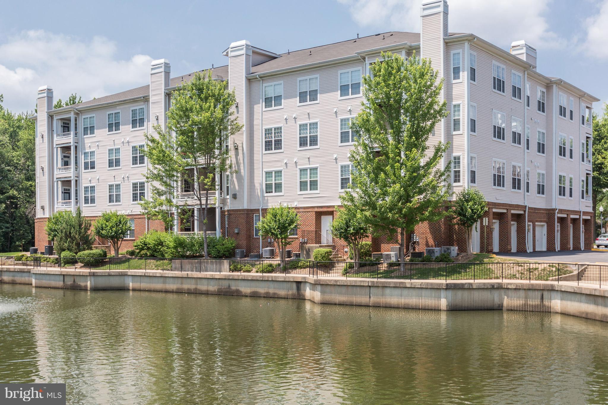 4330 Cannon Ridge Court, Unit 21 Fairfax, VA 22033 - Photo 1 of 24 a house with river in front of it