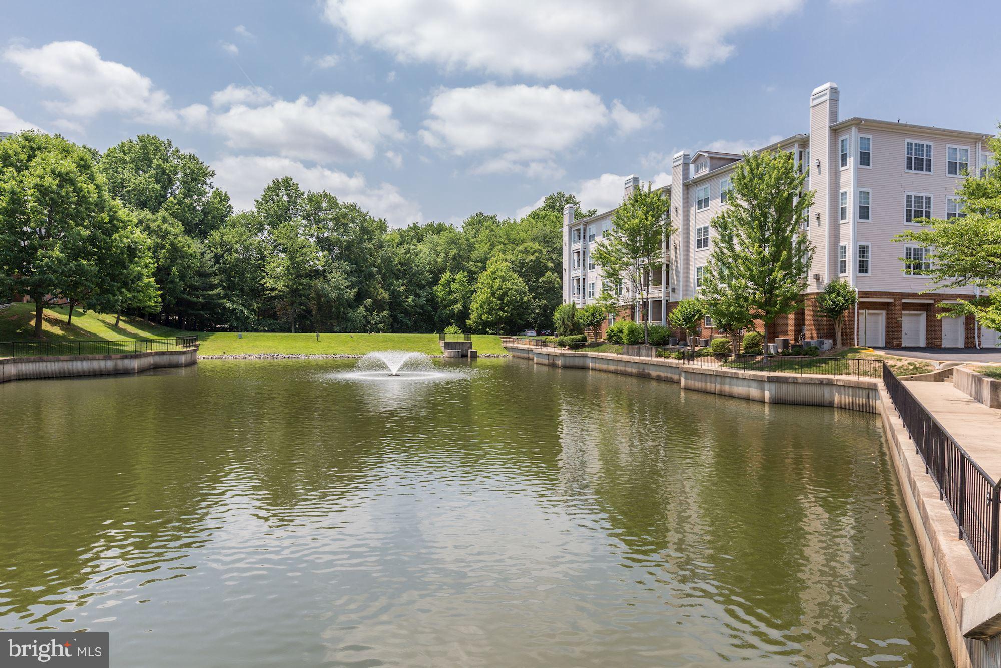 4330 Cannon Ridge Court, Unit 21 Fairfax, VA 22033 - Photo 18 of 24 a view of a lake with a building in the background