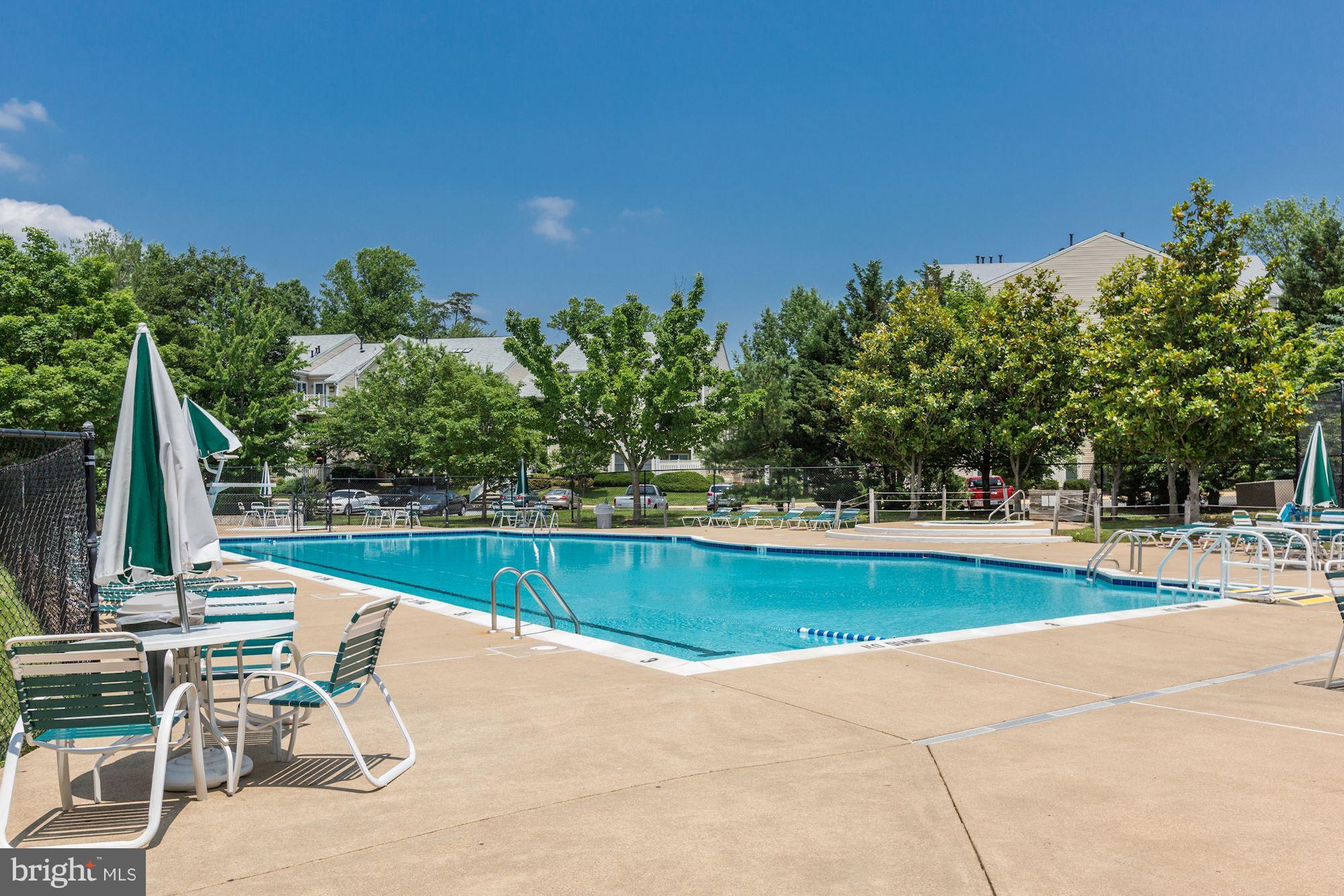 4330 Cannon Ridge Court, Unit 21 Fairfax, VA 22033 - Photo 20 of 24 a view of a swimming pool with a lounge chair