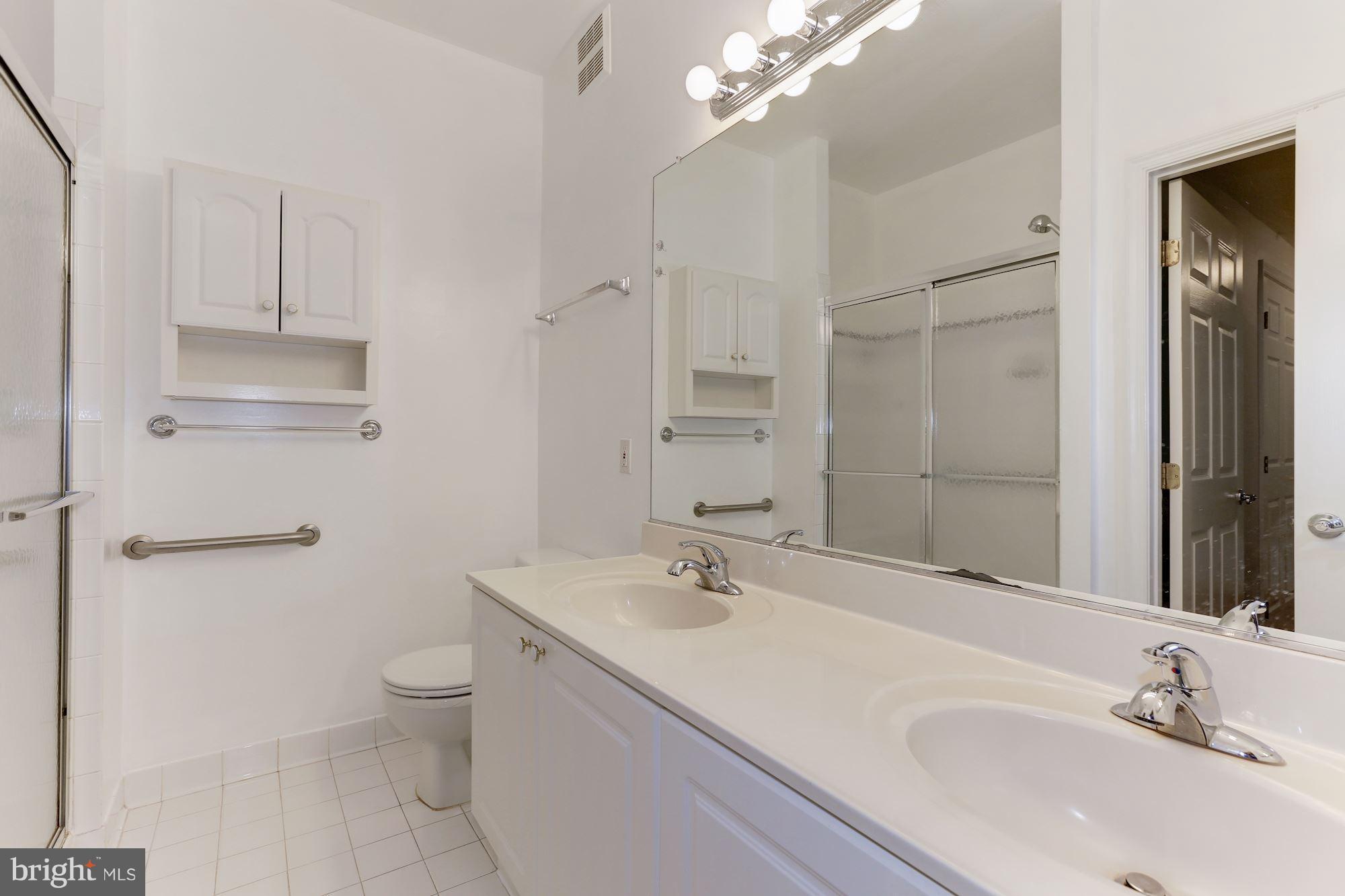 4330 Cannon Ridge Court, Unit 21 Fairfax, VA 22033 - Photo 9 of 24 a bathroom with a sink toilet and shower