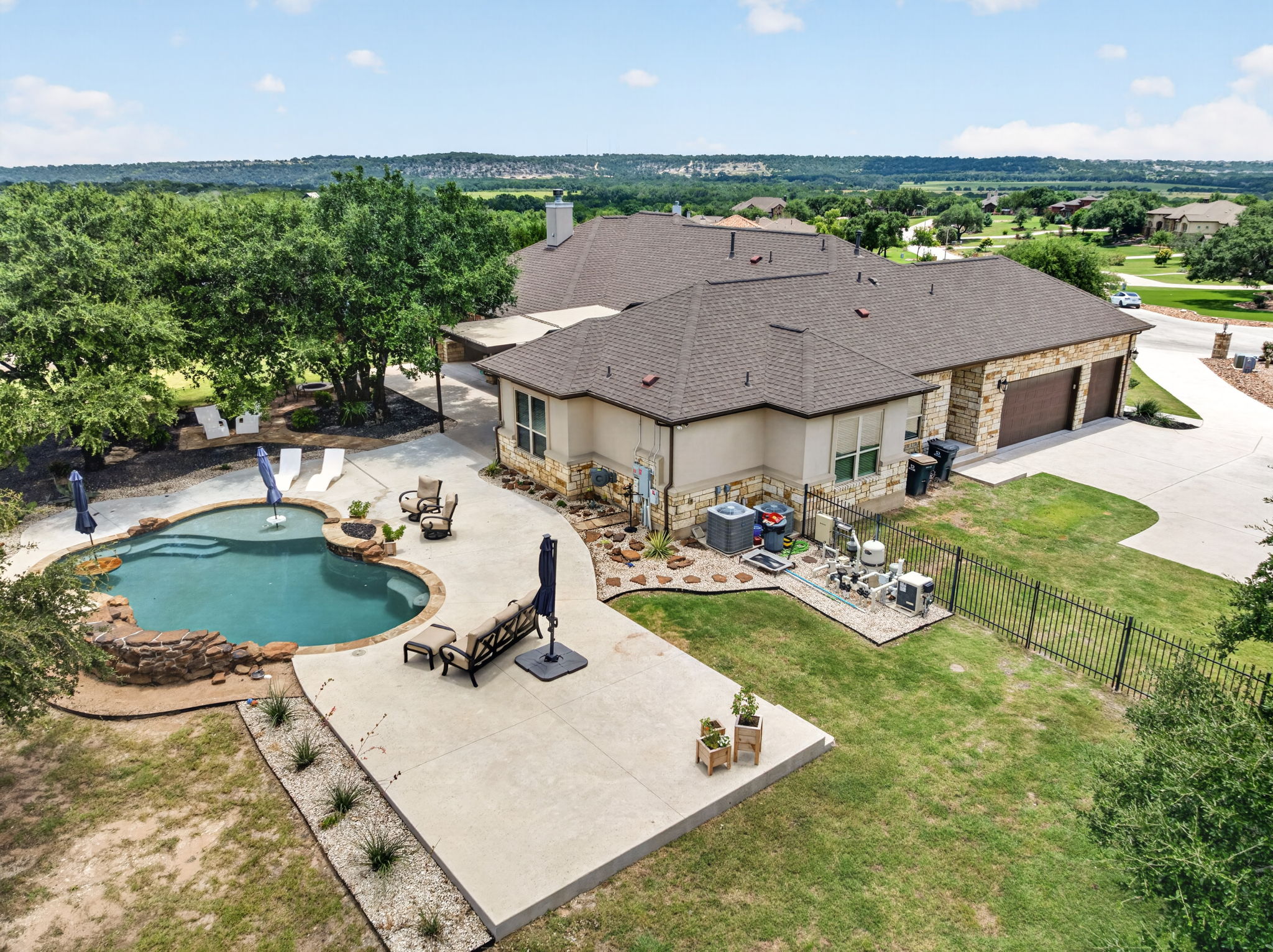 105 Coopers Hill Road Georgetown, TX 78633 - Photo 38 of 40 an aerial view of a house with swimming pool and garden