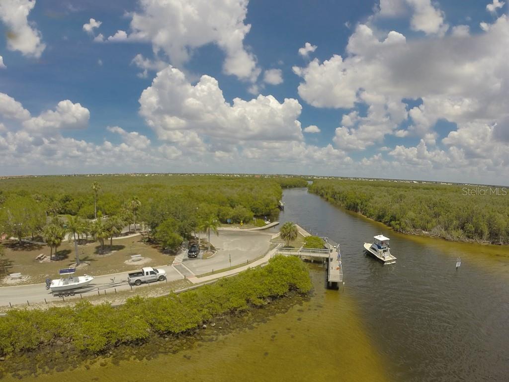 65 Colony Point Drive Punta Gorda, FL 33950 - Photo 12 of 19 a view of a lake and mountain