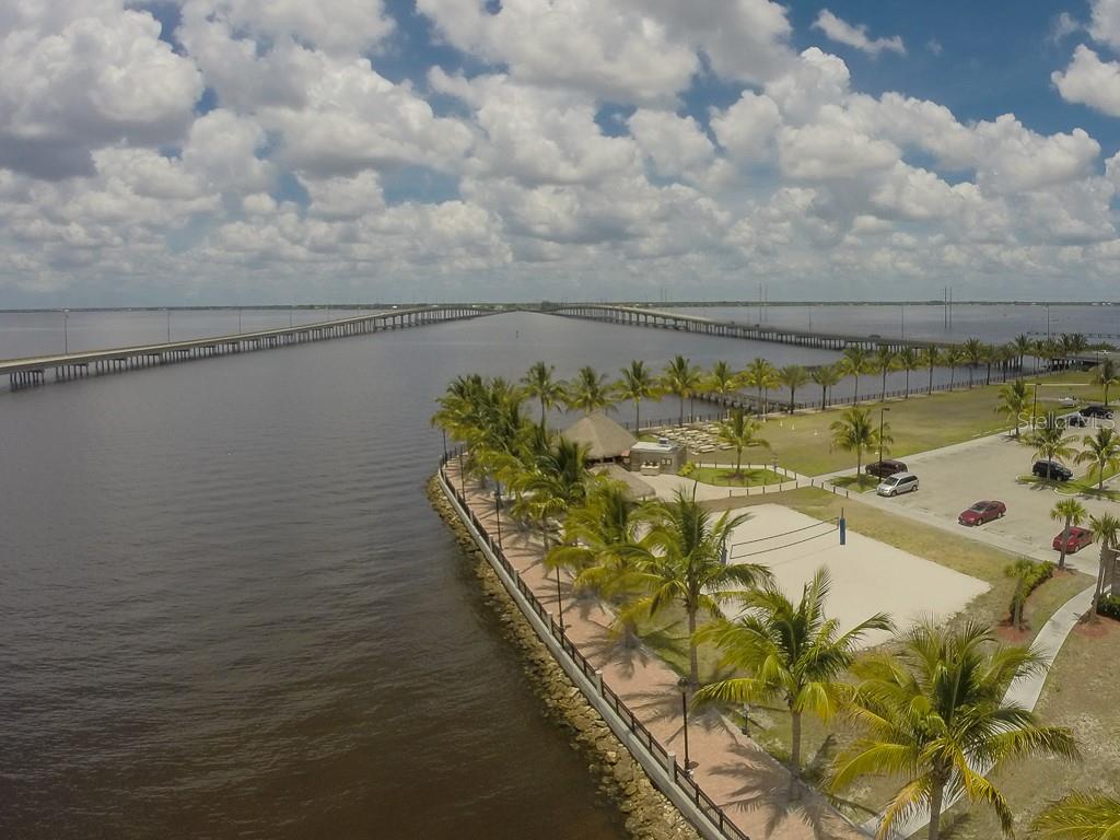 65 Colony Point Drive Punta Gorda, FL 33950 - Photo 15 of 19 a view of a swimming pool with a yard