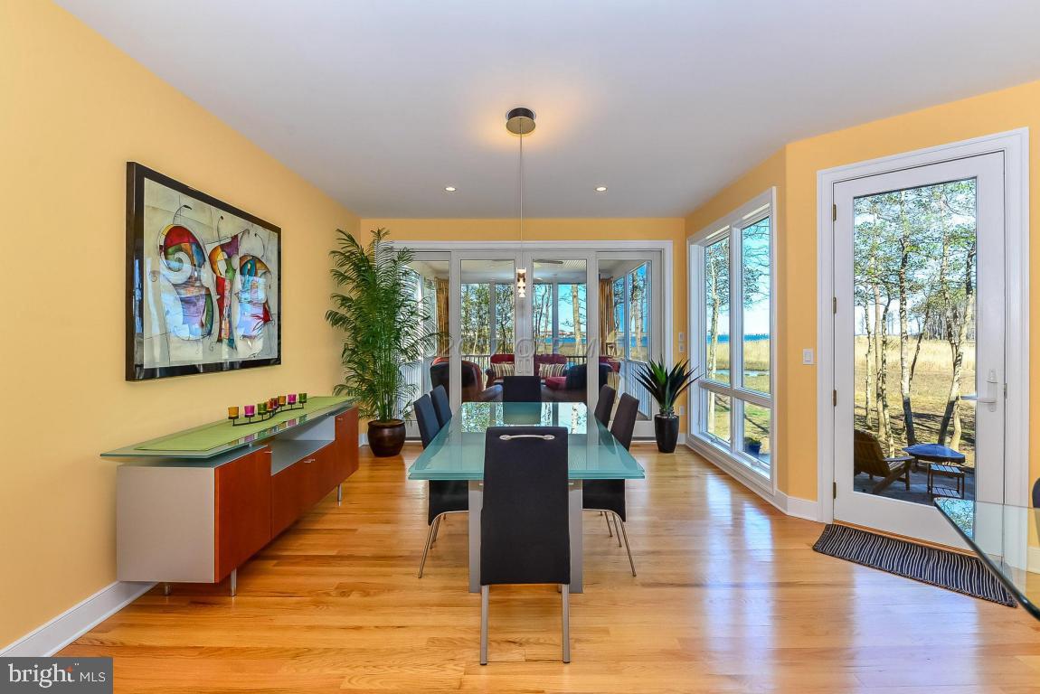 253 Charleston Road Ocean Pines, MD 21811 - Photo 22 of 76 a view of a living room and kitchen with a large window