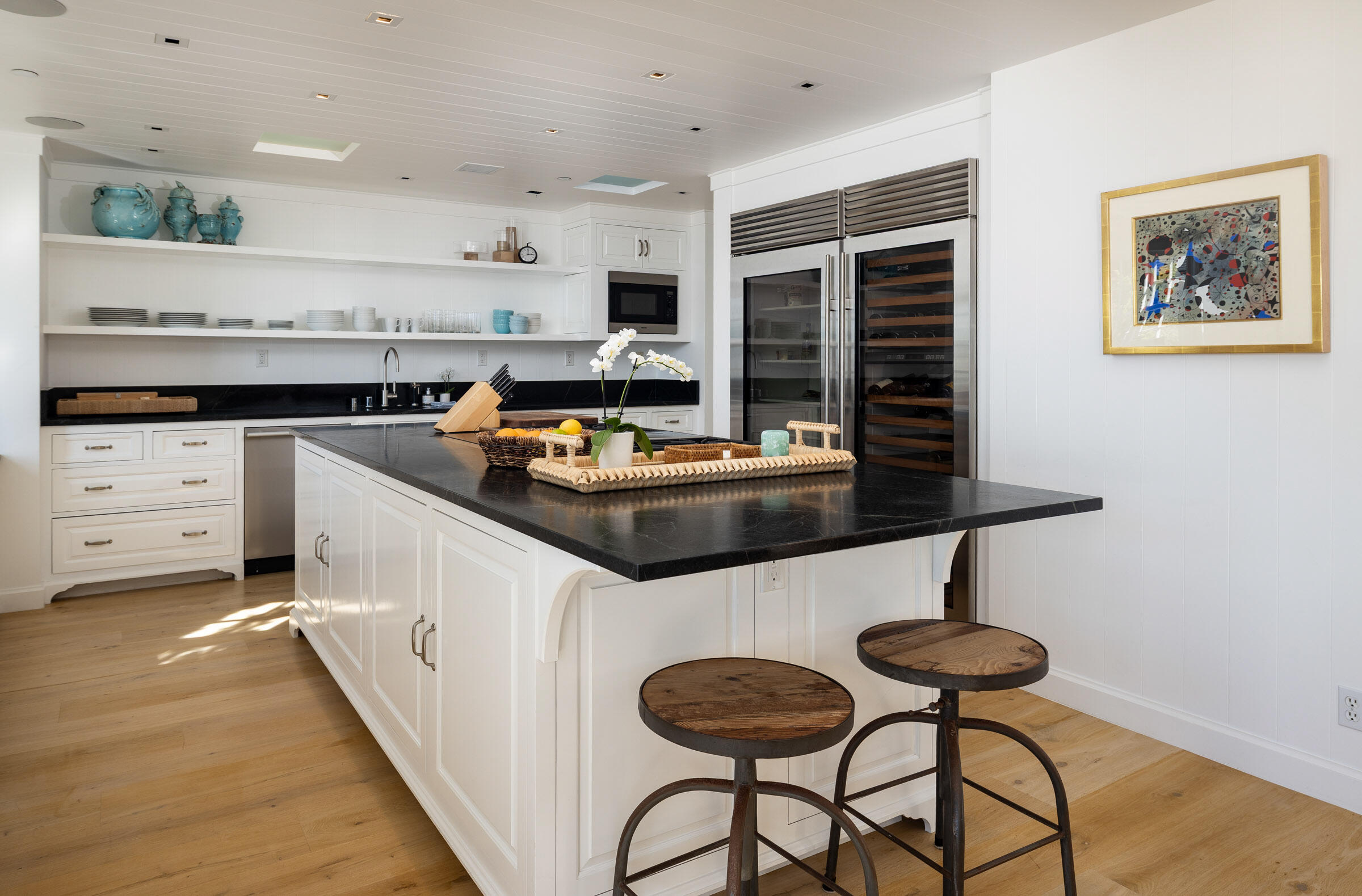 571 Sand Point Road Carpinteria, CA 93013 - Photo 13 of 49 a kitchen with stainless steel appliances a stove refrigerator sink and cabinets