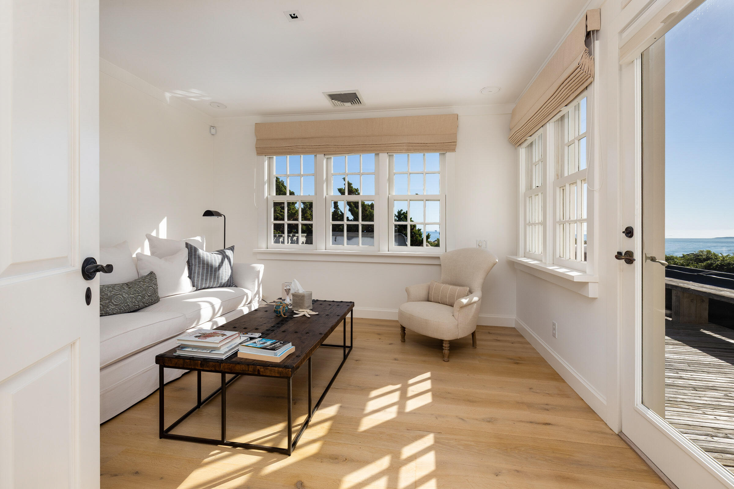 571 Sand Point Road Carpinteria, CA 93013 - Photo 25 of 49 a living room with furniture two window and a table