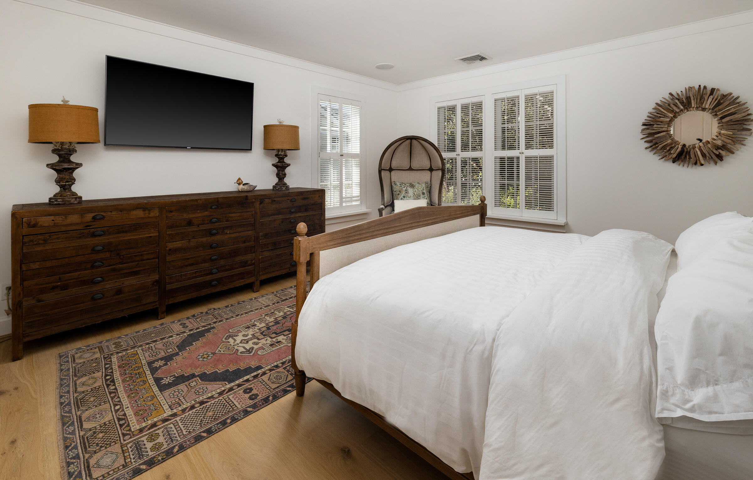 571 Sand Point Road Carpinteria, CA 93013 - Photo 32 of 49 a bedroom with a bed and a large window