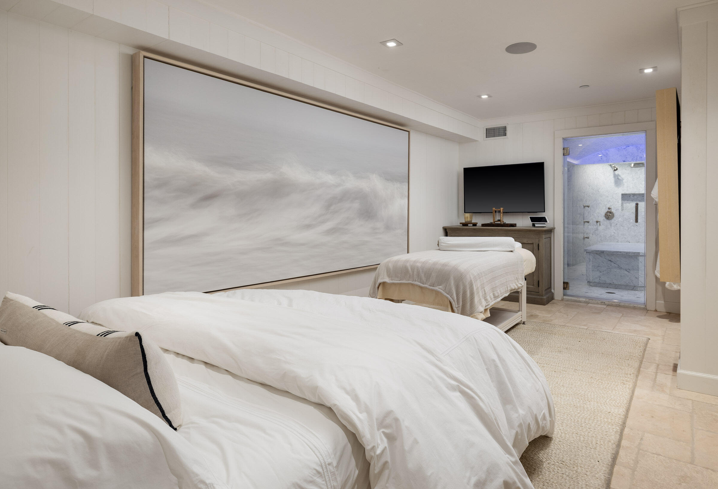 571 Sand Point Road Carpinteria, CA 93013 - Photo 38 of 49 a bedroom with two beds and a flat screen tv