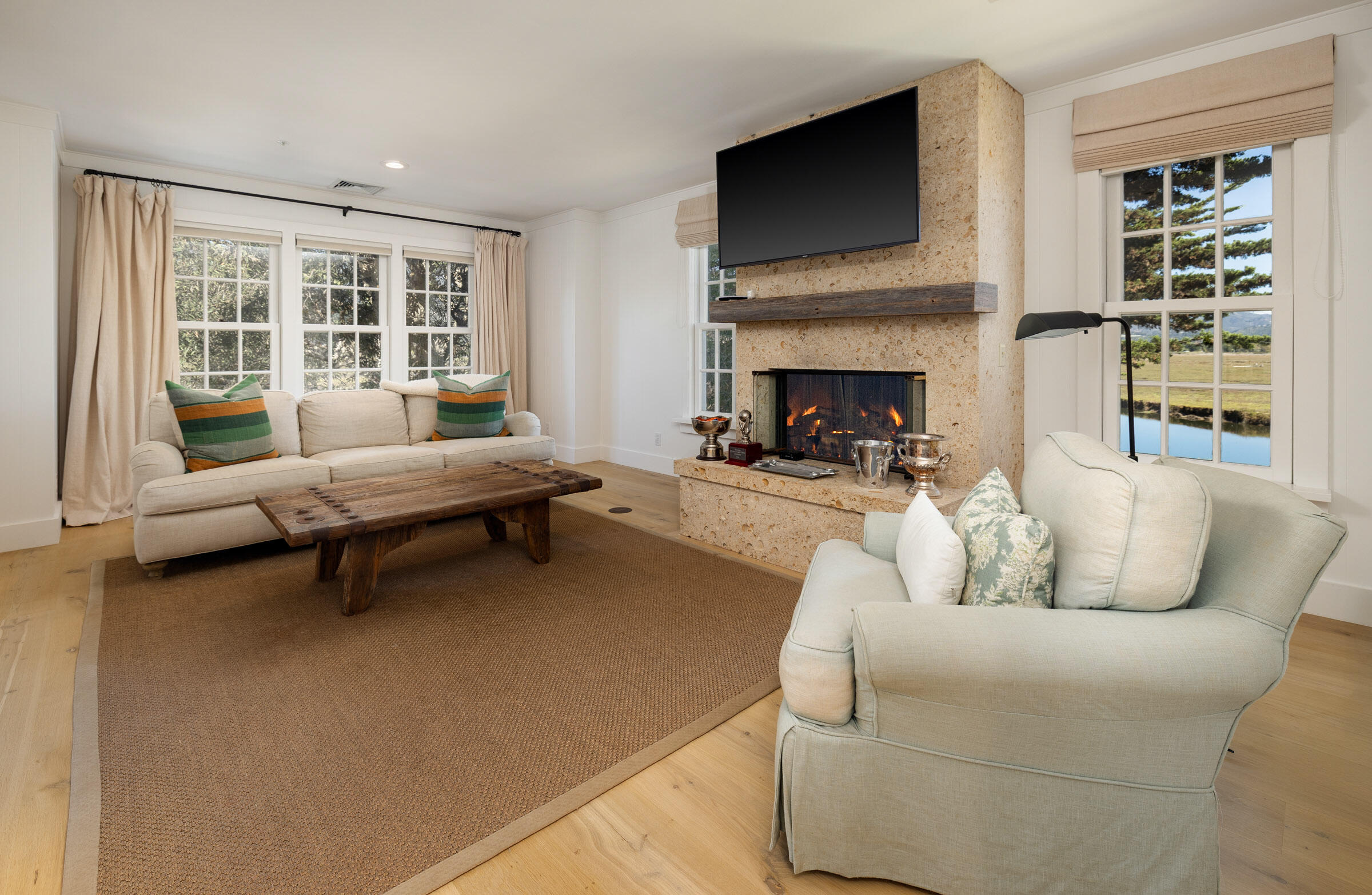 571 Sand Point Road Carpinteria, CA 93013 - Photo 43 of 49 a living room with furniture and a fireplace